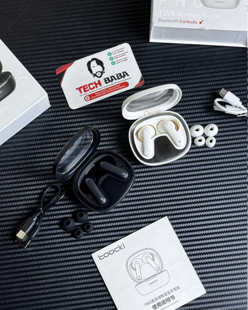 Toocki HE-068A Gaming Earbuds in White & Black Colour with their box components. Which are extra ear tips & a matching colour charging cable.