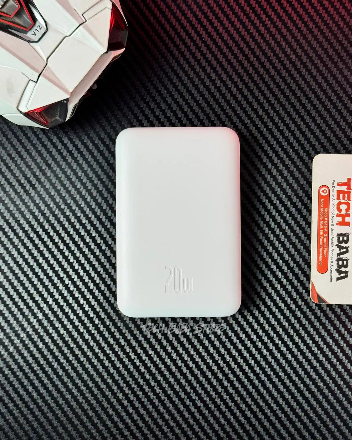 showing back closeup view of Baseus PPCXM10 Wireless PowerBank and also showing charging sedd .picture by TechBabaStore.pk