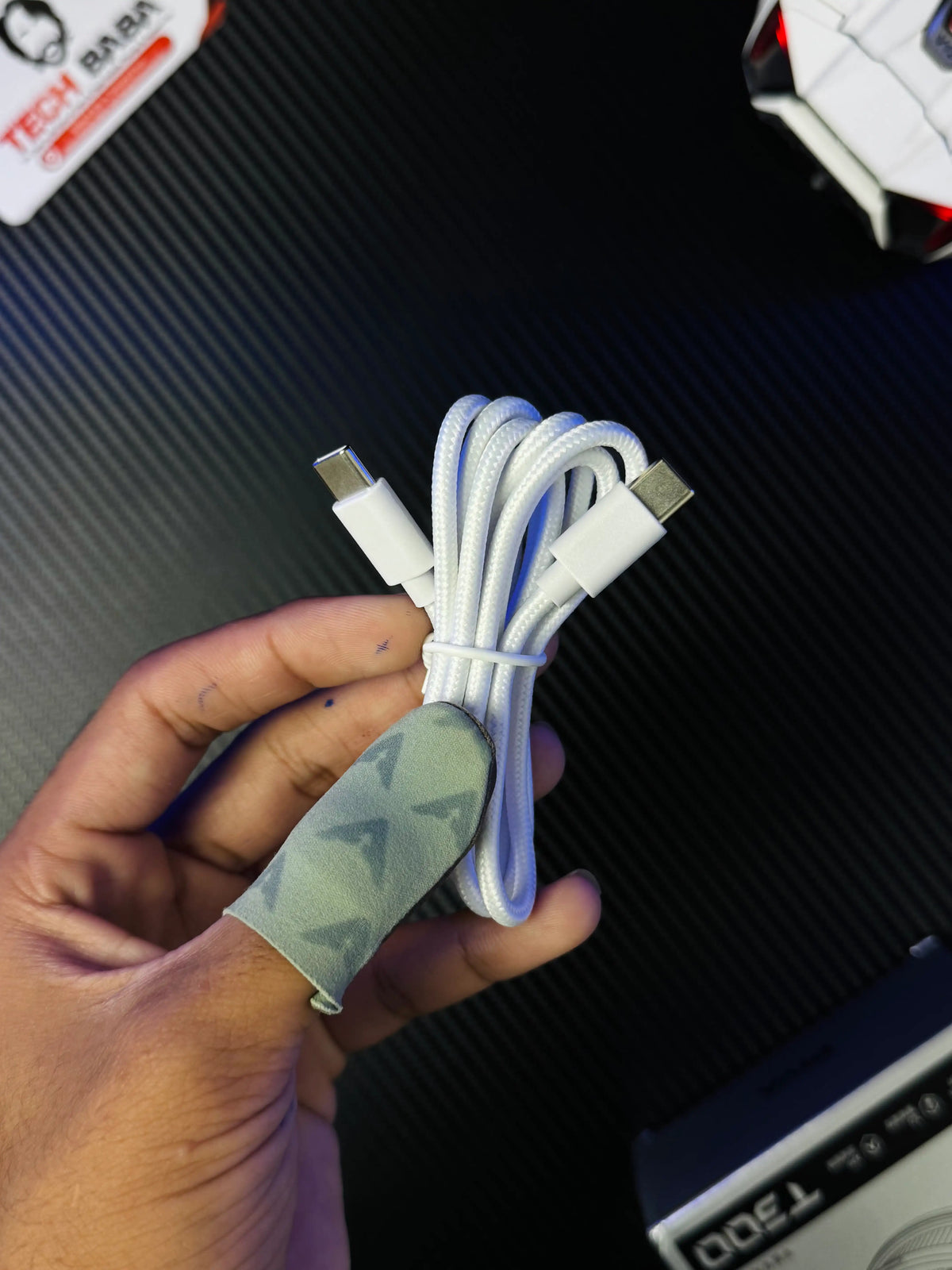 A hand holding Piva Titan T300 iPad Cooler — 45W Semiconductor Cooling Fan for PUBG Mobile which has showing CtoC type wiredpicture by TechBabaStore.pk