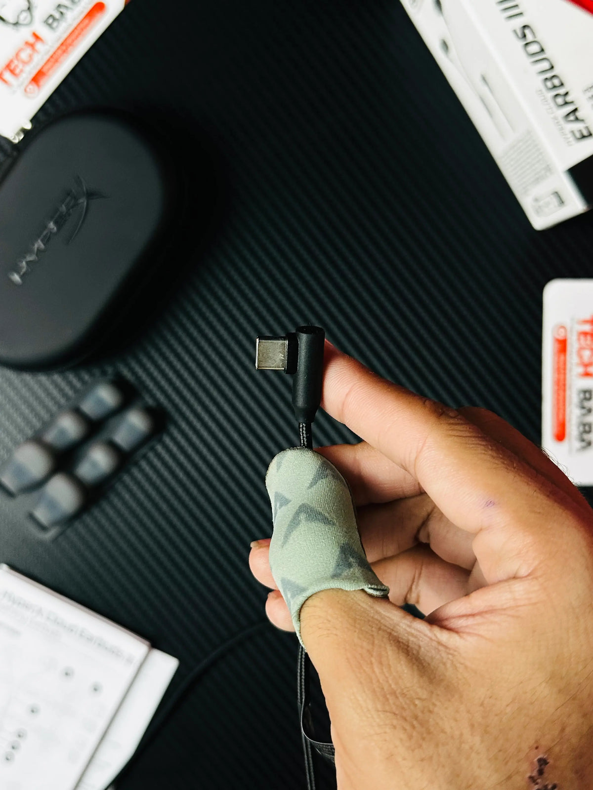 A hand holding C type of HyperX Cloud Earbuds III S USB-C Gaming Earbuds -picture by Techbabastore.pk
