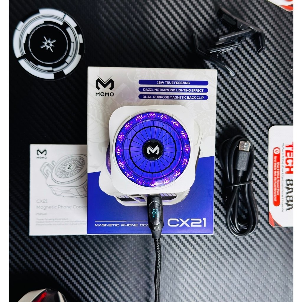 showing a information book, charging cable, colling plate, and a MEMO CX21 18W Magnetic Phone Cooler. picture by techbabastore.pk