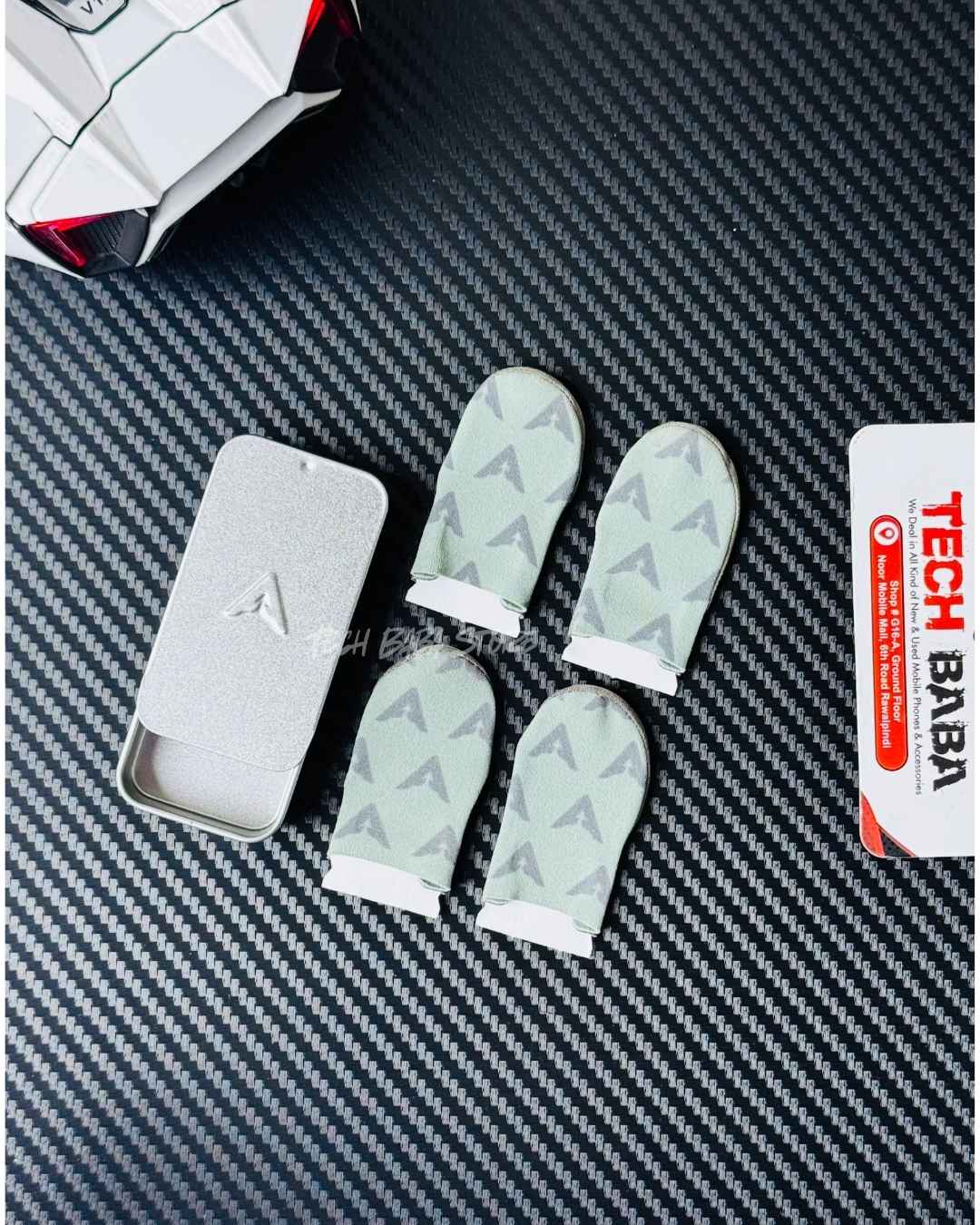 Showing All 4 iva DragonScale 2 Thumb Sleeves with their metalic box packing. Picture by TechBabaStore.pk