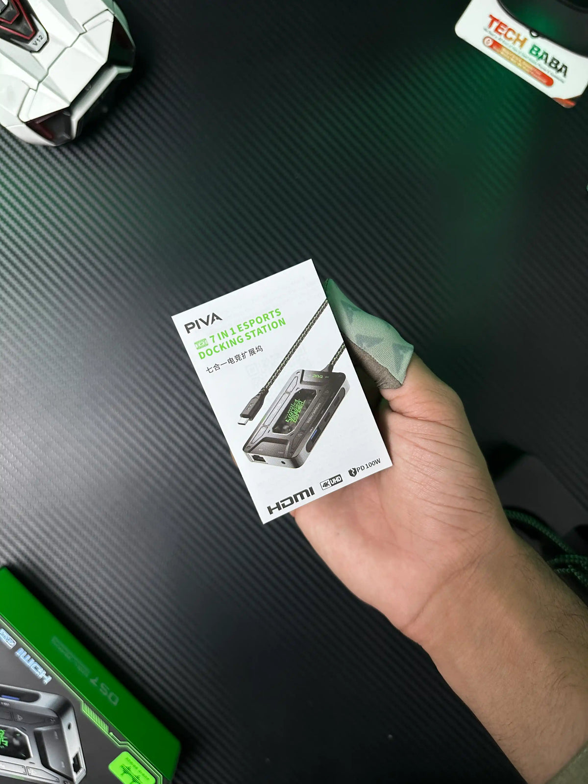 A hand holding a user manual of Piva Ds7 Gaming Splitter - picture by TechBabaStore.pk