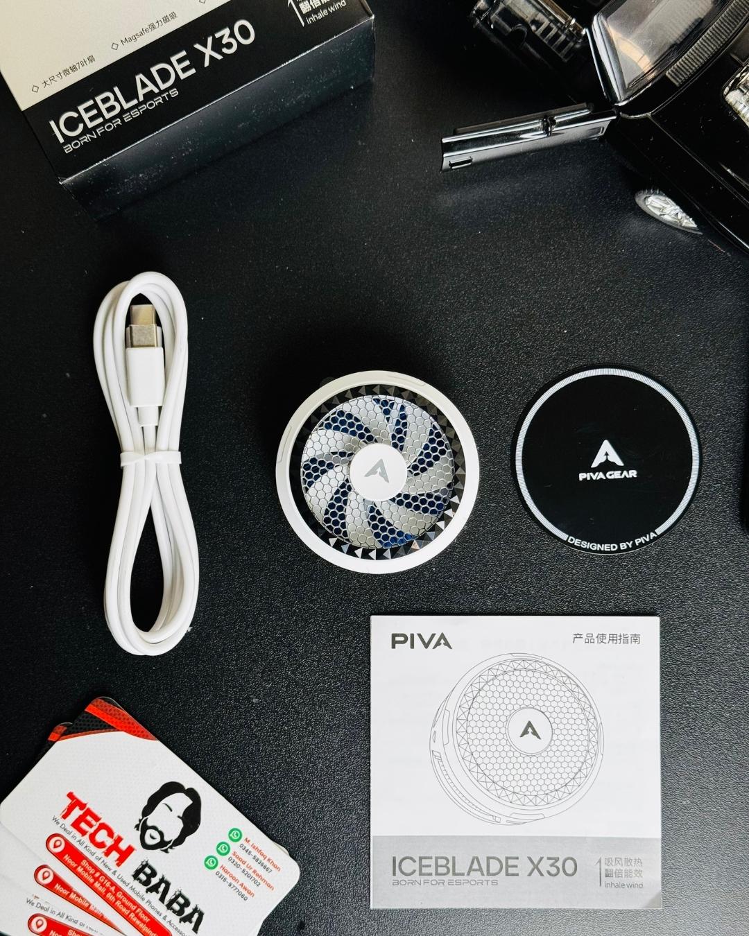 showing a Piva X30 Mobile Cooling Fan , pacaging box, fan plate and charging cable and information bokk. picture by techbaba stre.pk