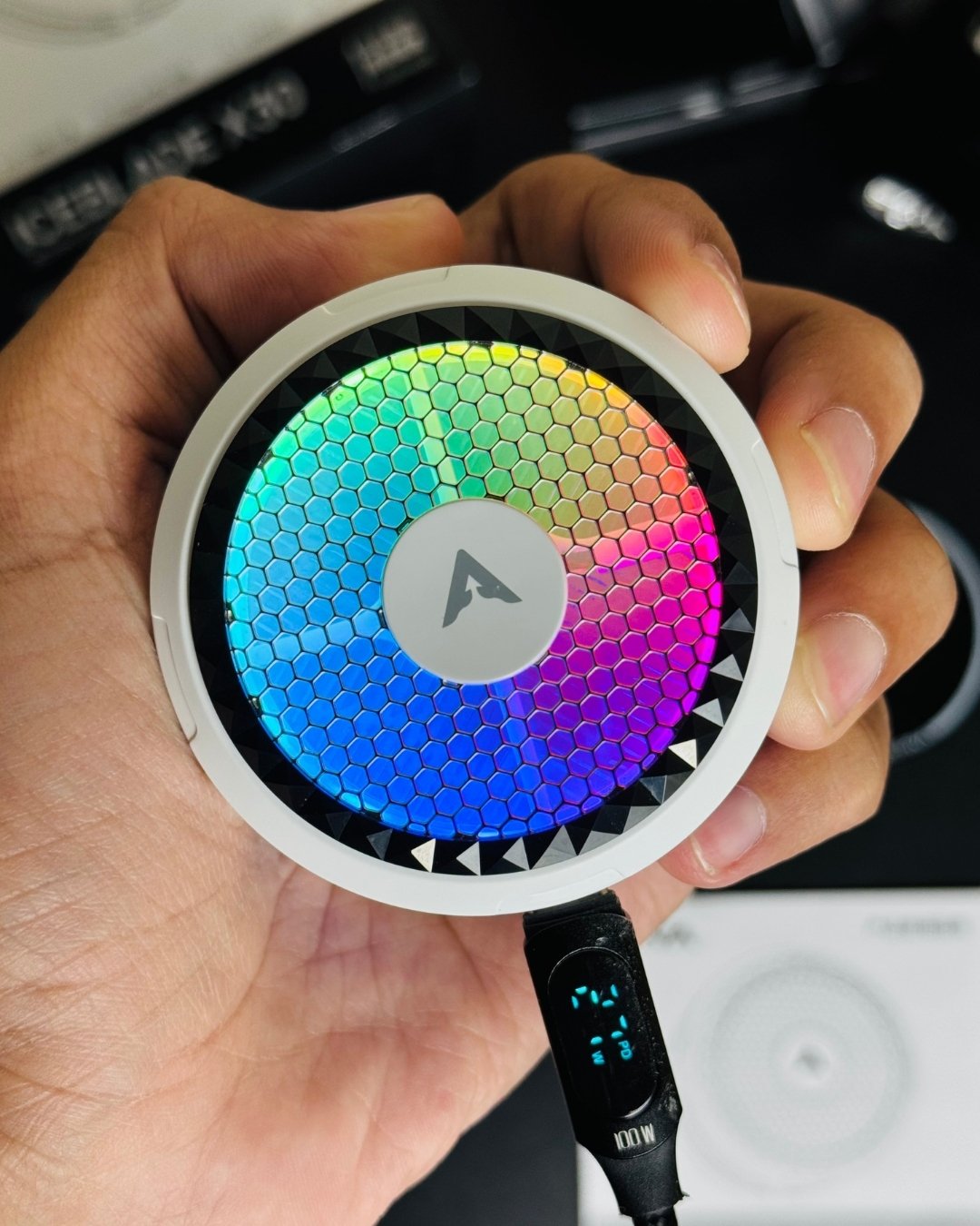 a hand holding a Piva_X30_Mobile_Cooling_Fan and showing closeup view of lighting and mode. picture by techbabastore.pk
