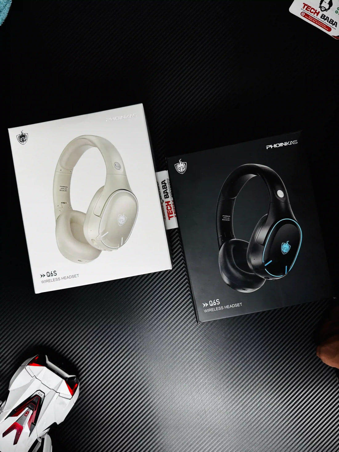 showing black and white Phoinikas Q6S Wireless Gaming Headset — Bluetooth 5.3, Detachable Mic, 30Hrs Battery | Best PUBG Headset Pakistan.picture by TechBabaStore.pk
