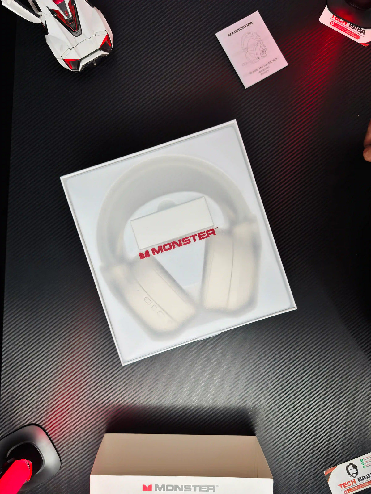 showing packing of white_Monster_Maxstar_MQH09_Wireless_Gaming_Headphone_50mm_Driver_Bluetooth_5.4_IPX5_Best_PUBG_Headset_Pakistan. picture by TechBabaStore.pk