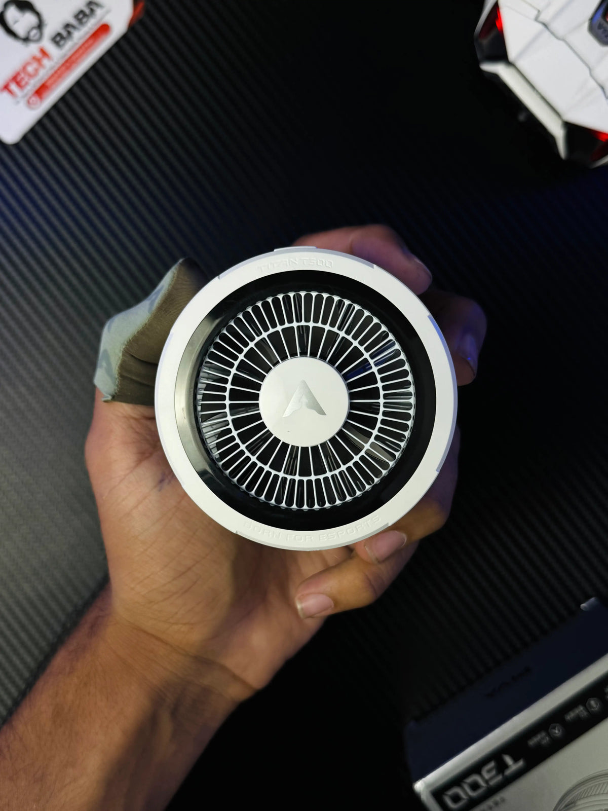 A hand holding Piva Titan T300 iPad Cooler — 45W Semiconductor Cooling Fan for PUBG Mobile which has showing closep shot of colling fan.picture by TechBabaStore.pk
