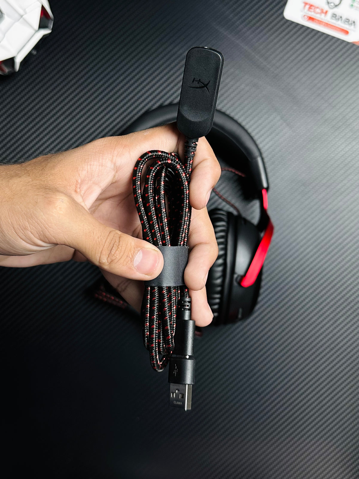 A hand holding HyperX Cloud III Gaming Headset for PUBG Mobile which has showing control dogal with 3.5mm wire.picture by TechBabaStore.pk