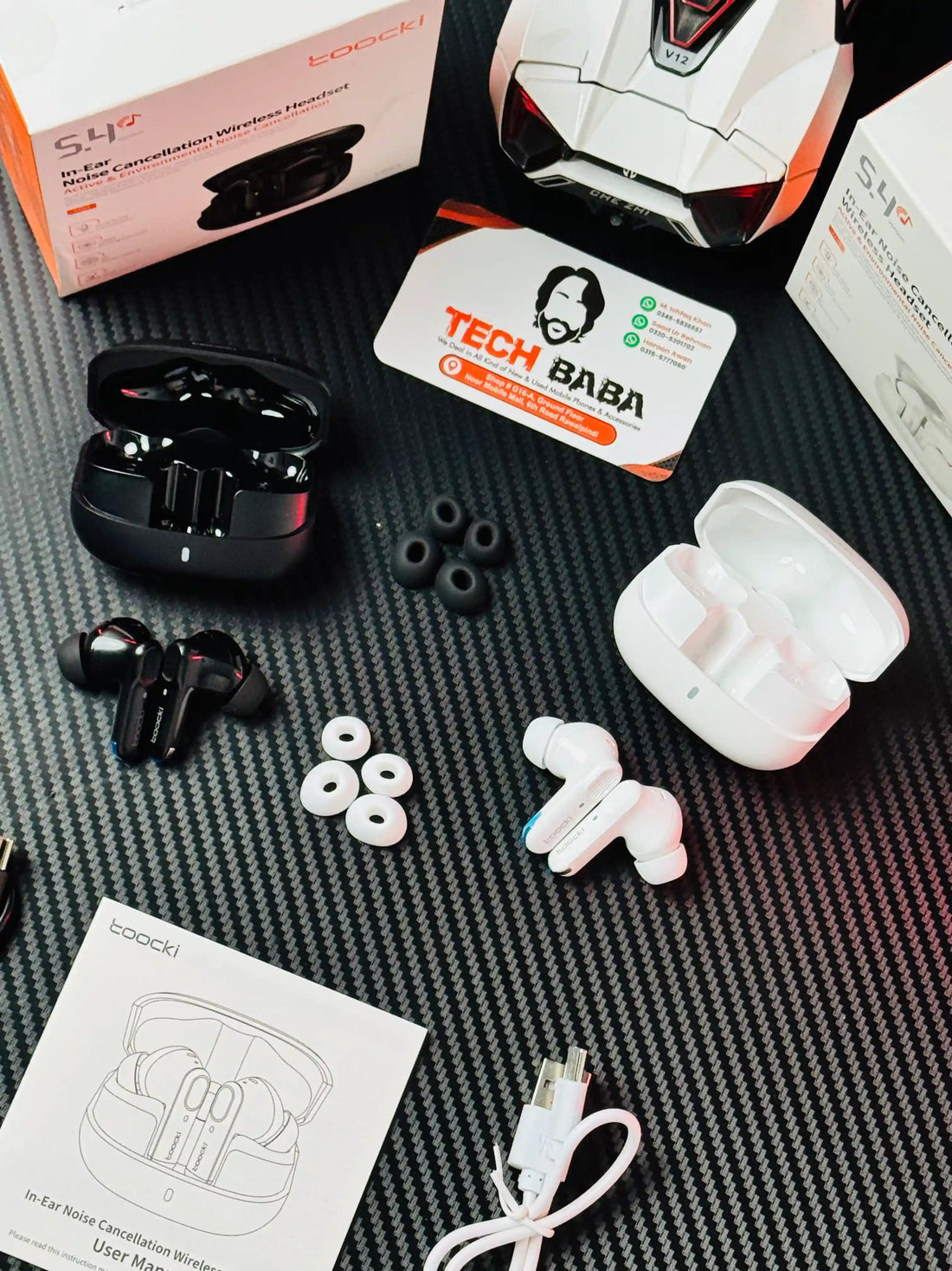 showing all things of Black and White Tocki Zero Delay Gaming Earbuds_picture by TechBabaStore.pk