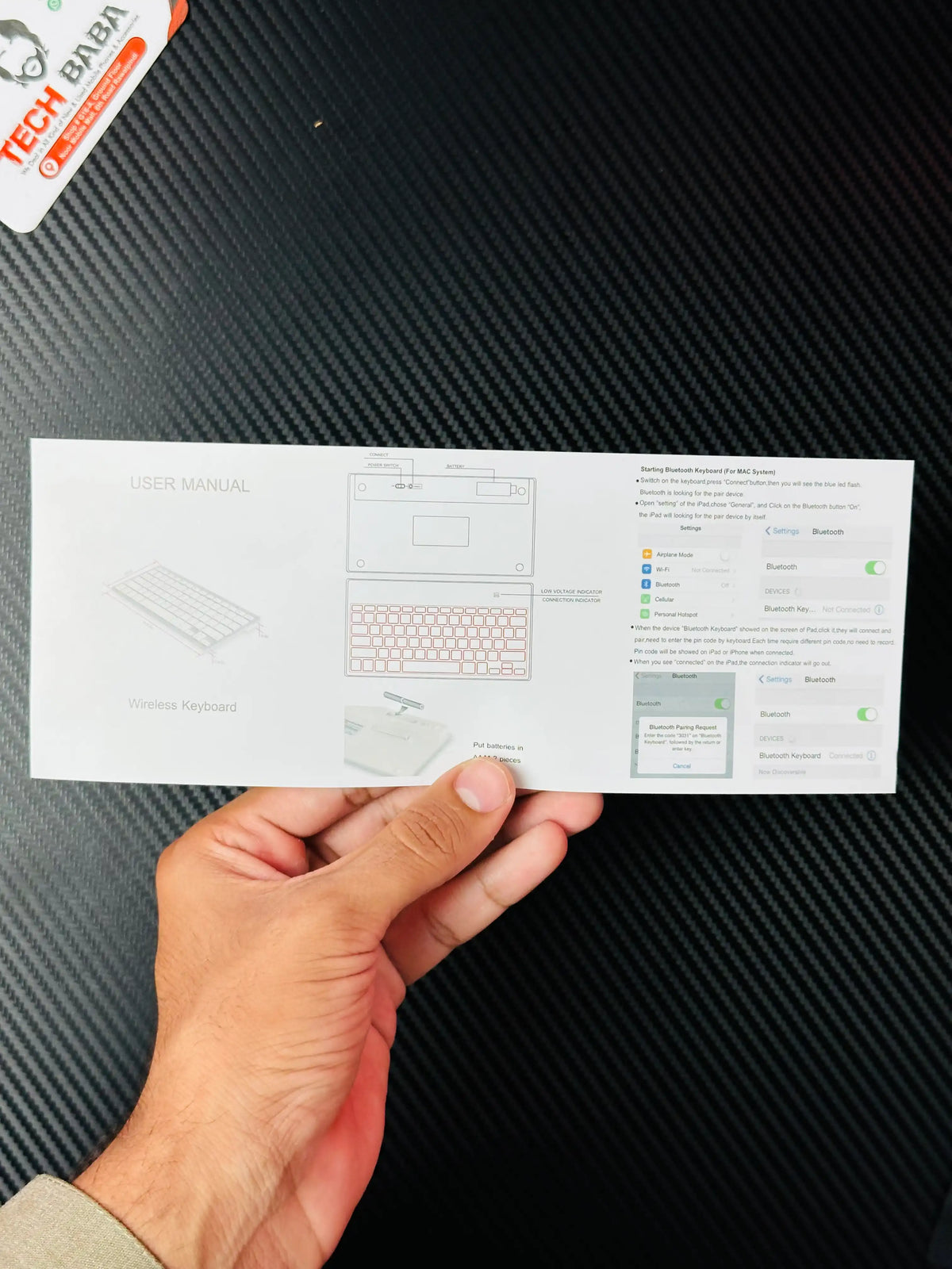 a hand holding BKC001 Bluetooth Keyboard Price in Pakistan | TechBaba Store
(56 characters) user manual _picture by Techbabastore.pk